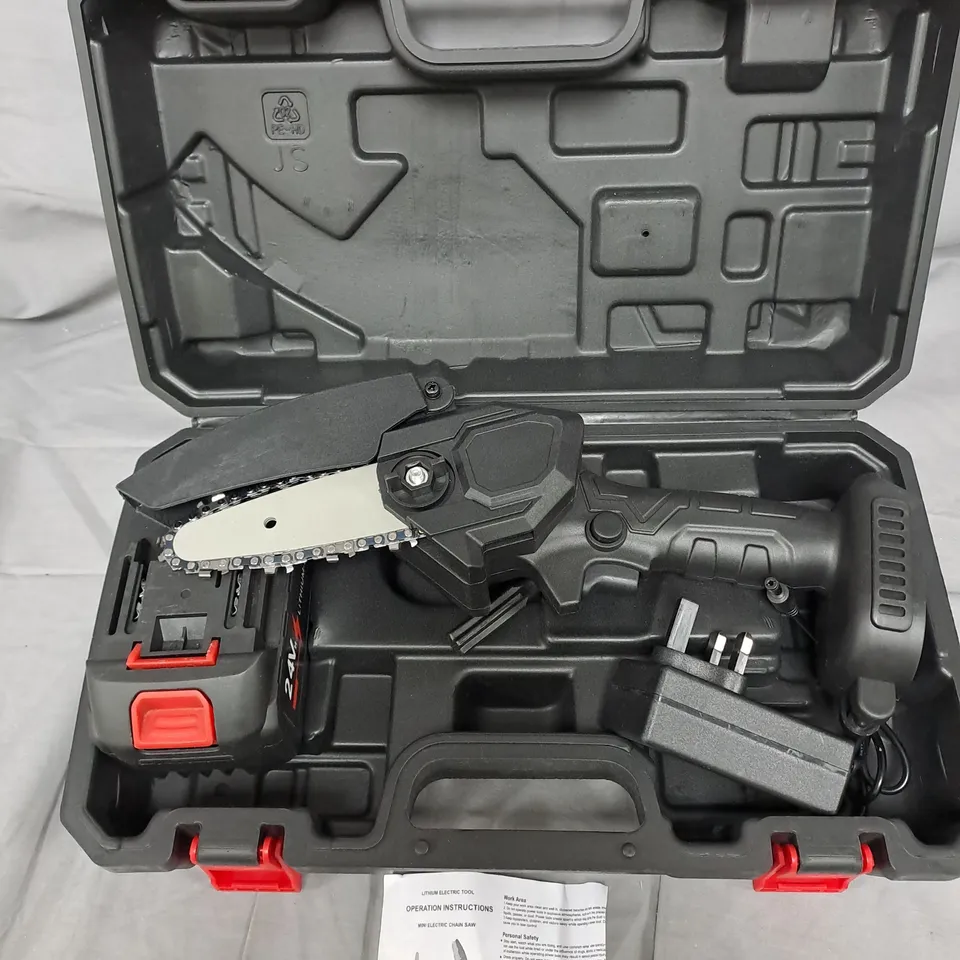 Cordless reciprocating saw with blade in hard case