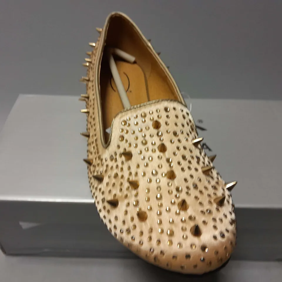 APPROXIMATELY 13 CASANDRA SPIKED SLIPONS IN CHAMPAGNE SATIN IN VARIOUS SIZES