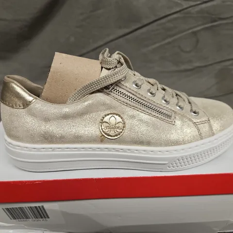 BOXED PAIR OF RIEKER TRAINERS IN METALLIC GOLD SIZE 38