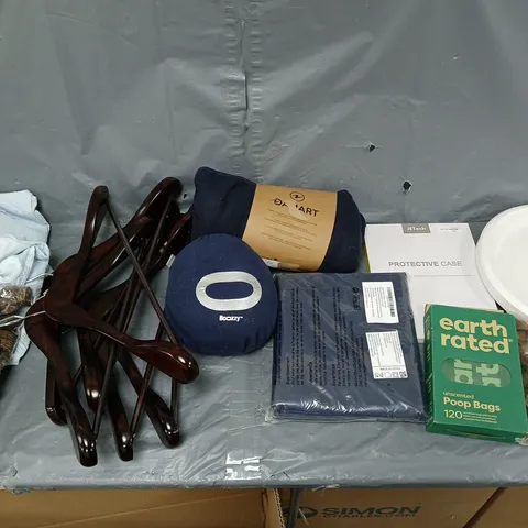 BOX OF APPROXIMATELY 15 ASSORTED ITEMS TO INCLUDE - POOP BAGS, BCOZZY PILLOW, AND WOODEN HANGERS ETC. 