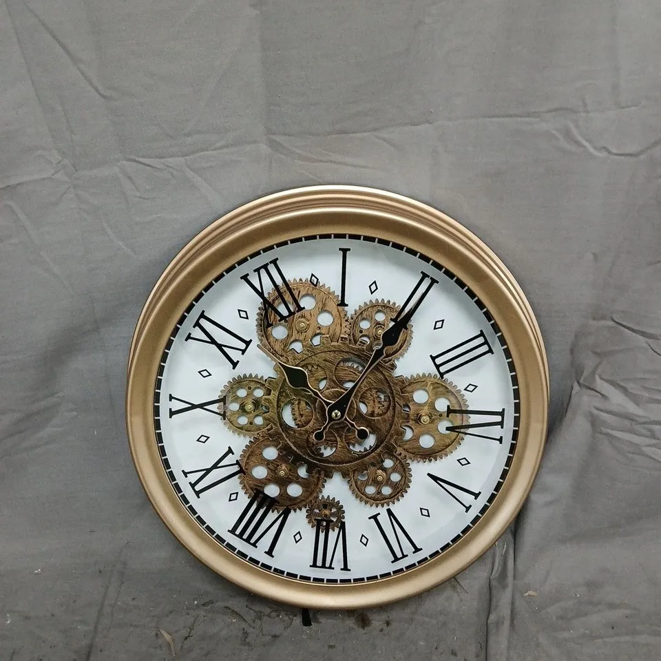 BRASS-TONE SKELETON GEAR WALL CLOCK WITH ROMAN NUMERALS