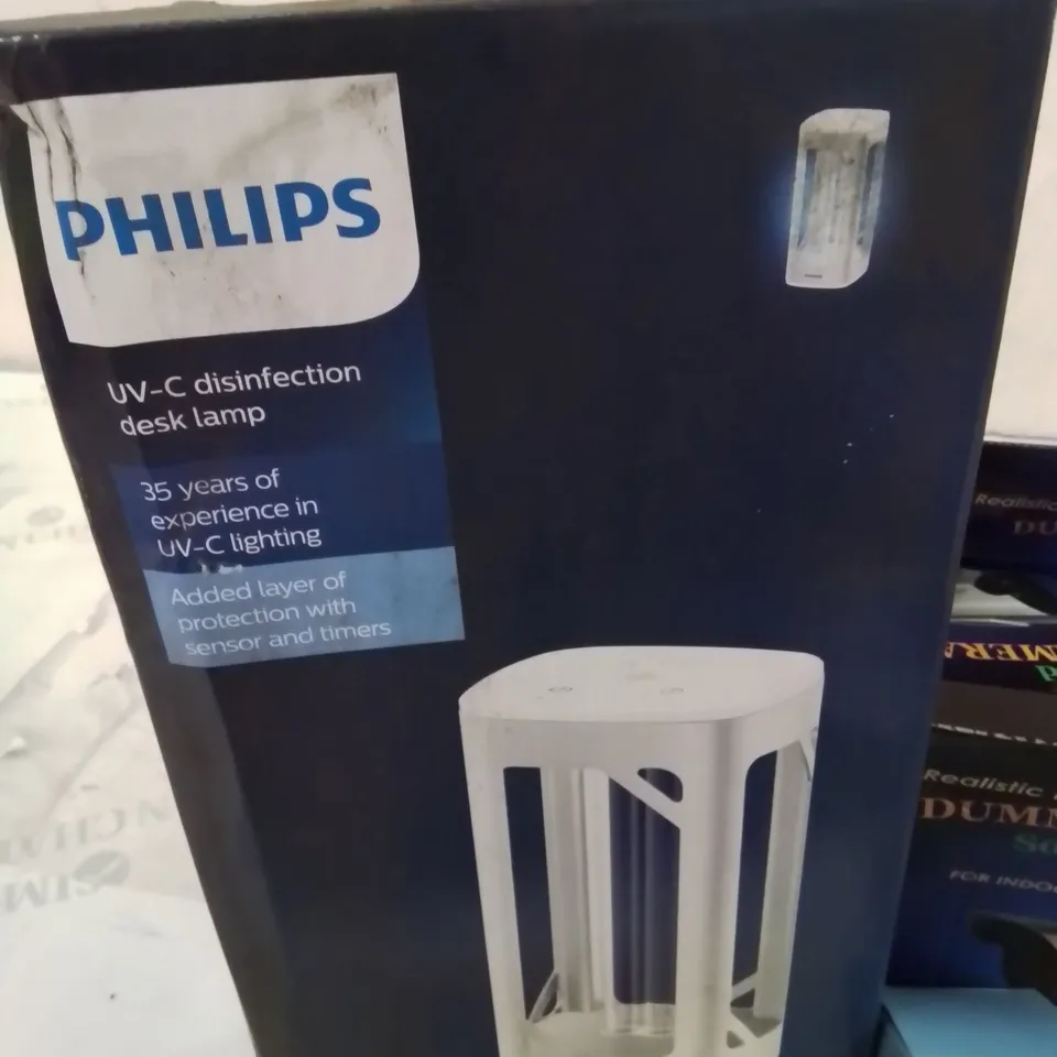 BOX CONTAINING LARGE AMOUNT OF BOXED ELECTRICAL ITEMS TO INCLUDE: DISINFECTION DESK LAMP, DUMMY CCTV CAMERA, CHARGER CABLES, PHONE CASES AND LOTS MORE.