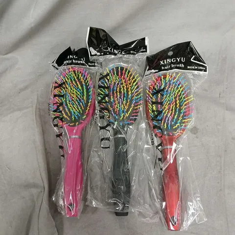 BOX OF APPROXIMATELY 50 HAIRBRUSHES IN ASSORTED COLOURS