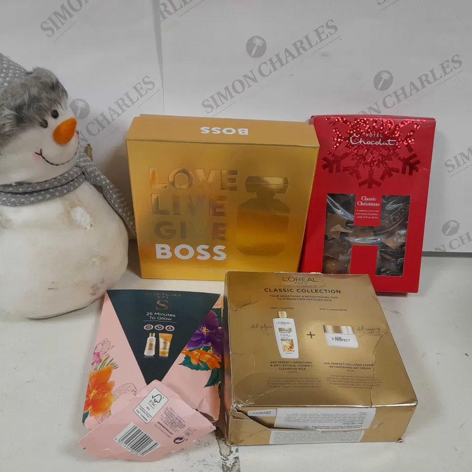 APPROXIMATELY 25 ASSORTED PRODUCTS TO INCLUDE; SNOWMAN PLUSH, LARGE GIN GLASS, MILK TO CARAMEL SLEEKSTERS, PAMPER NIGHT, BOSS THE SCENT FOR HER 50ML, 25 MINUTES TO GLOW, RUDOLPH THE RED NOSED REINDEER RRP £567