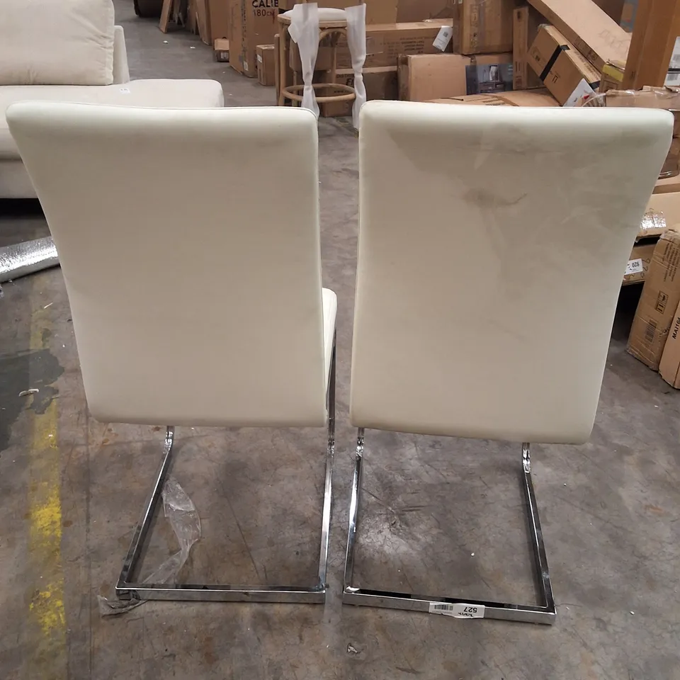PAIR OF WHITE FAUX LEATHER DINING CHAIRS ON METAL BASES 