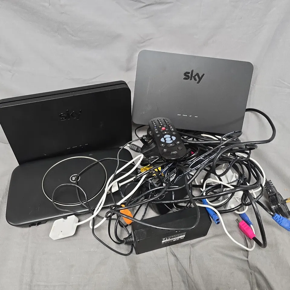 APPROXIMATELY 12 ASSORTED HOUSEHOLD ITEMS TO INCLUDE CABLES, ROUTERS, REMOTES, ETC