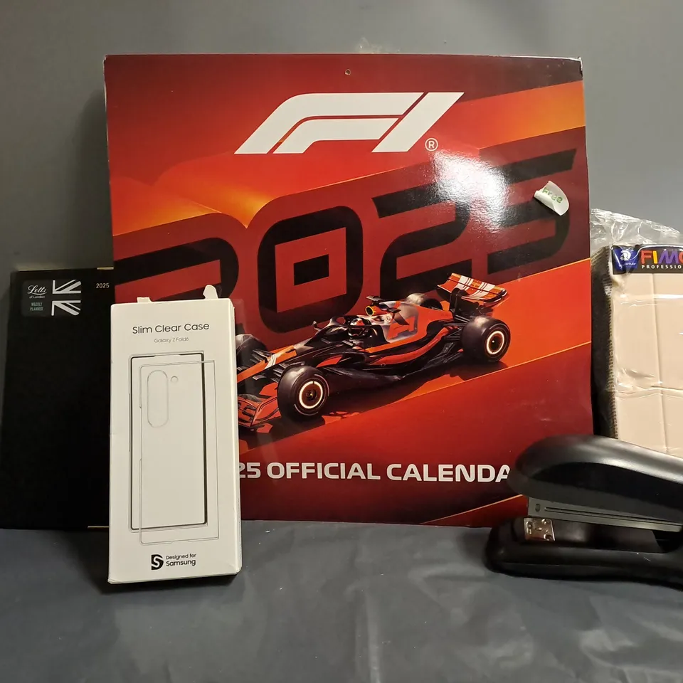 BOX OF APPROX 20 ASSORTED ITEMS TO INCLUDE - F1 2025 OFFICIAL CALENDAR , RAPID STAPLER , FIMO MODELLING CLAY ETC