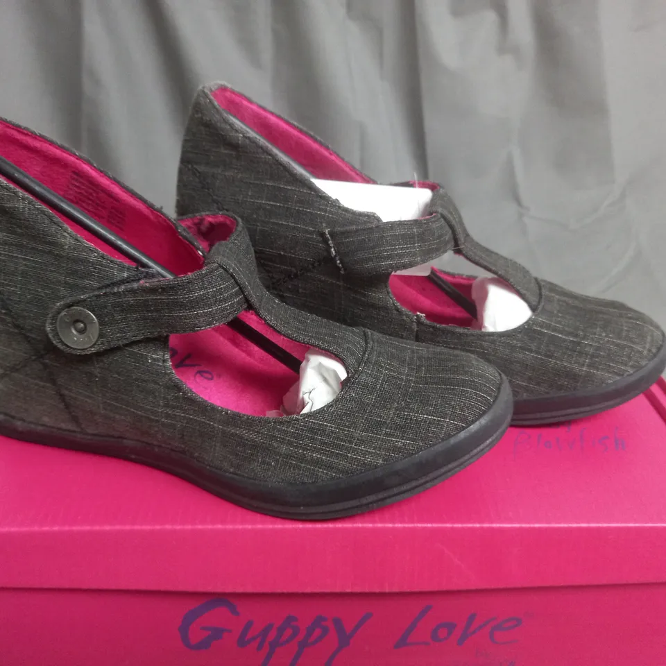 BOX OF APPROXIMATELY 12 BLACK  GUPPY LOVE BY BLOWFISH SHOES IN VARIOUS SIZES 