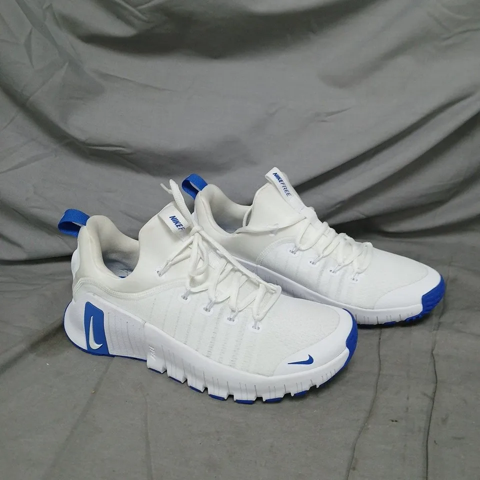 UNBOXED PAIR OF NIKE FREE WHITE AND BLUE TRAINERS - SIZE 7