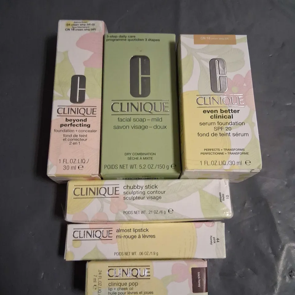 SIX ASSORTED CLINIQUE BEAUTY PRODUCTS TO INCLUDE; LIP AND CHEEK OIL, ALMOST LIPSTICK, SERUM FOUNDATION SPF 20, FACIAL SOAP- MILD, FOUNDATION AND CONCEALER AND CHUBBY STICK