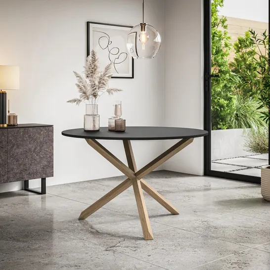 Lot 170: BOXED MALVERN ROUND DINING TABLE - BLACK TOP/ OAK LEGS (2 ...