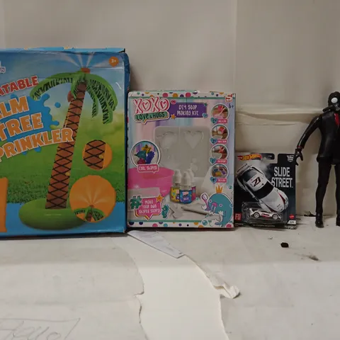 BOX OF ASSORTED KIDS TOYS AND PRODUCTS TO INCLUDE; INFLATABLE PALM TREE,HOT WHEELS CAR,DIY SOAP MAKING KIT,FIGURE