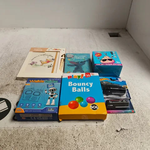 TOTE OF APPROXIMATELY 15 ASSORTED TOY/GAME ITEMS TO INCLUDE WINNIE THE POOH NOTEBOOK, HOT WHEELS CARS, BOUNCY BALLS, SQUISHY BUN, STITCH NOTEBOOK ETC