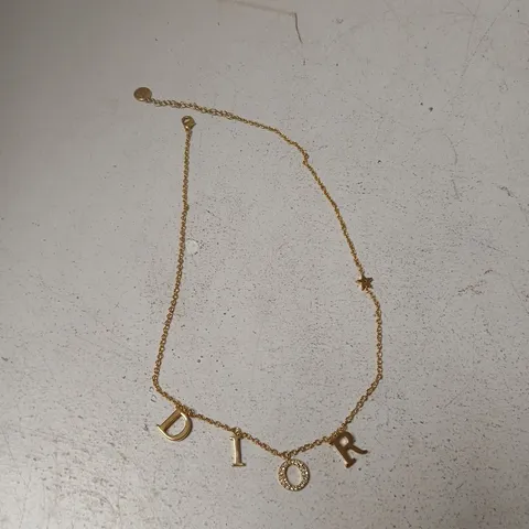 DIOR GOLD-TONE NECKLACE WITH DIOR LETTER CHARMS – BOXED