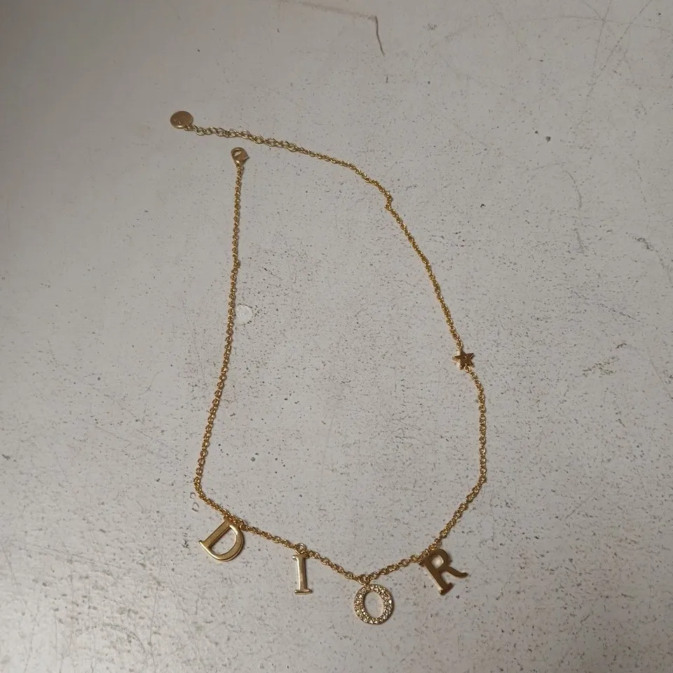 DIOR GOLD-TONE NECKLACE WITH DIOR LETTER CHARMS – BOXED
