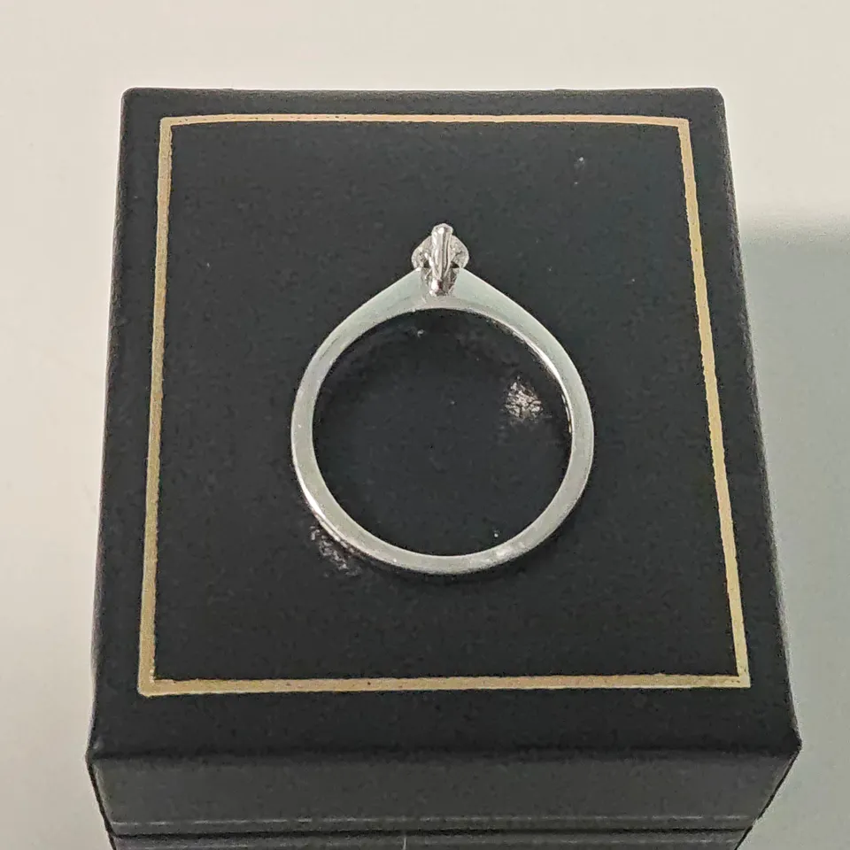 18CT WHITE GOLD SOLITAIRE RING SET WITH A MARQUISE CUT NATURAL DIAMOND