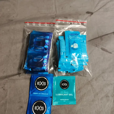 APPROXIMATELY 20 PACKS OF ASSORTED CONDOMS AND LUBE SACHETS