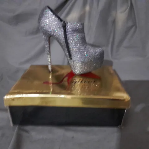 APPROXIMATELY 10 BOXED PAIRS OF SILVER HIGH HEEL BOOTS VARIOUS SIZES
