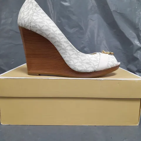 BOXED PAIR OF MICHAEL KORS HAMILTON WEDGE SHOES IN CREAM SIZE EU 41