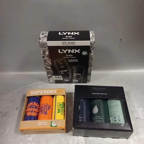 LOT OF 3 ASSORTED COSMETIC BOXSETS TO INCLUDE - LYNX BLACK BODY DUO - SUERDRY BODY SPRAYS - TED BAKER HAIR & BODY WASH TRIO