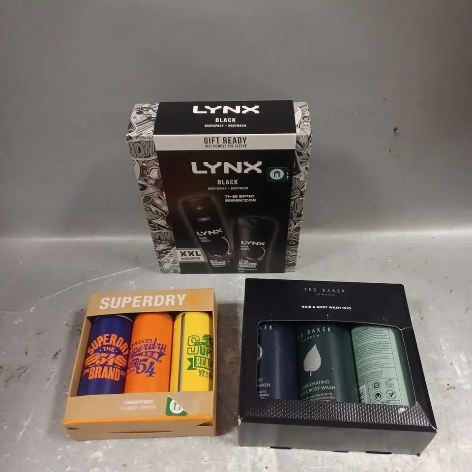 LOT OF 3 ASSORTED COSMETIC BOXSETS TO INCLUDE - LYNX BLACK BODY DUO - SUERDRY BODY SPRAYS - TED BAKER HAIR & BODY WASH TRIO