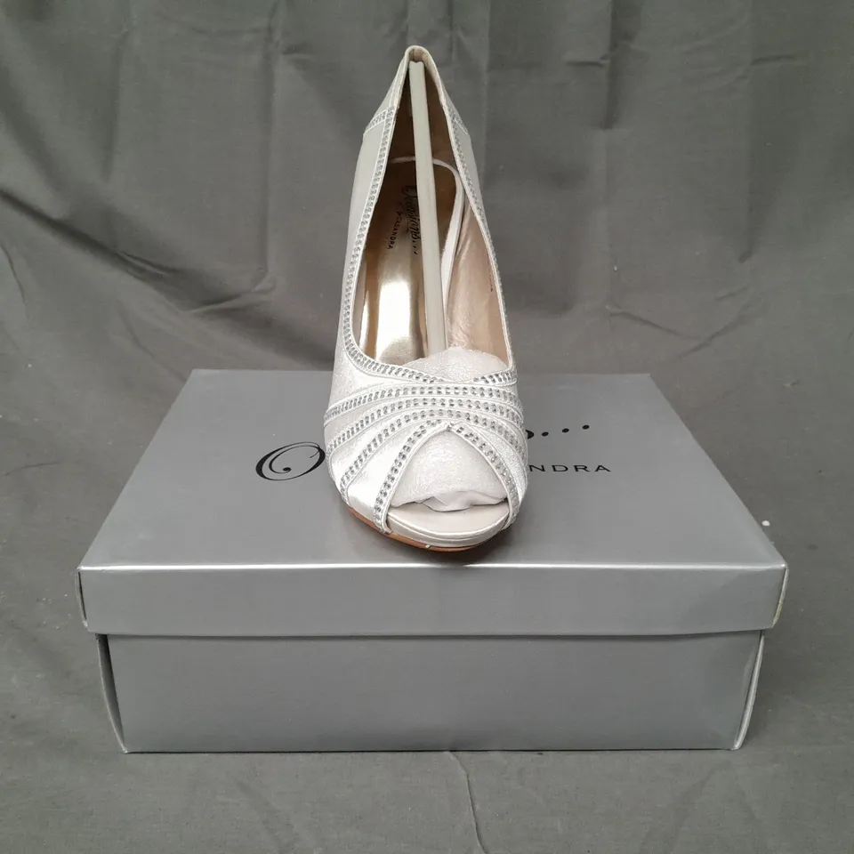 BOX OF APPROXIMATELY 10 BOXED PAIRS OF OCCASIONS BY CASANDRA PEEP TOE HIGH HEEL SHOES IN IVORY SATIN W. JEWEL EFFECT - VARIOUS SIZES