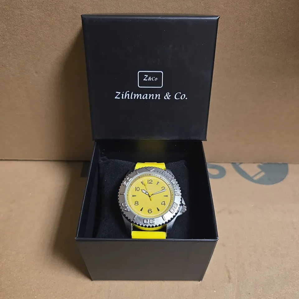 ZIHLMANN & CO STAINLESS STEEL WATCH WITH YELLOW FACE & RUBBER STRAP