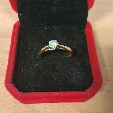 9CT GOLD SOLITAIRE RING SET WITH A NATURAL DIAMOND