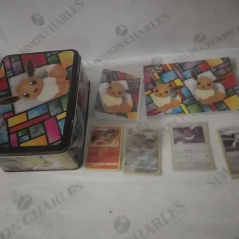 POKEMON TCG EEVEE TIN CONTAINING SOME SLEEVED CARDS, NOTEBOOK, EEVVEELUTION POSTCARDS AND CARD WALLETS
