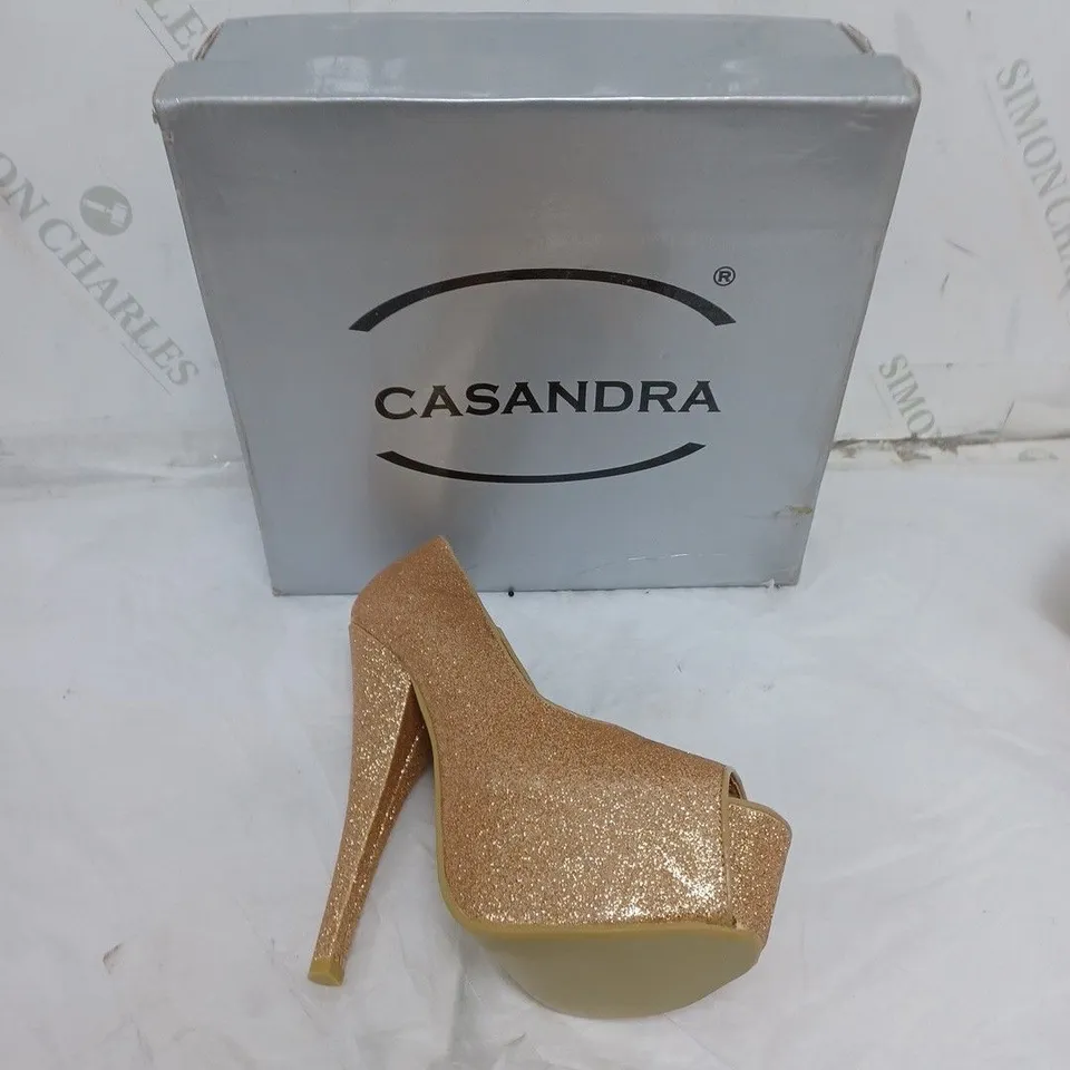 LARGE BOX OF BOXED APPROXIMATELY 10 CASSANDRA OPEN TOE HEELS IN GOLD GLITTER IN VARIOUS SIZES