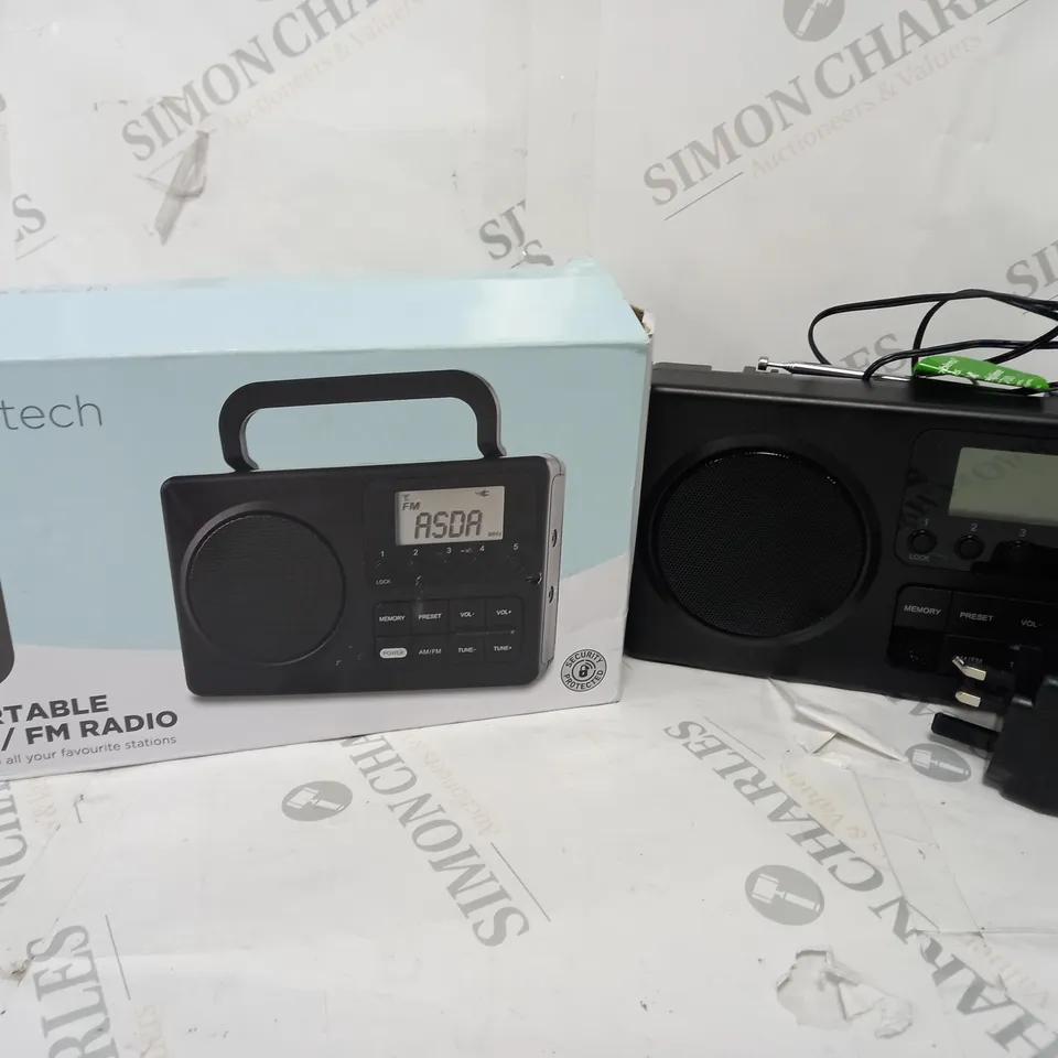 BOXED PORTABLE AM/FM RADIO IN BLACK