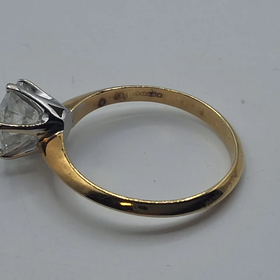 18CT GOLD SOLITAIRE RING SET WITH A NATURAL DIAMOND WEIGHING +-1.56CT
