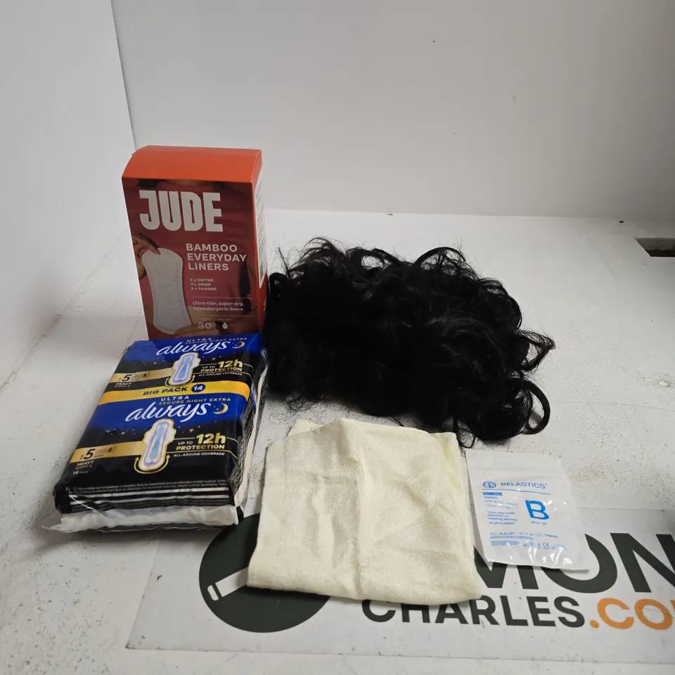 TOTE OF APPROXIMATELY 10 ASSORTED ITEMS INCLUDING RELASTICS, A BLACK CURLY WIG AND A BAMBOO FACE CLOTH
