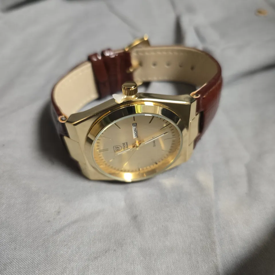 ERNEST FERDINAND GOLD TONE DIAL LEATHER STRAP WATCH 