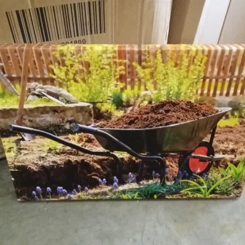 WHEELBARROW IN A GARDEN BY NOBILIOR - WRAPPED CANVAS PRINT