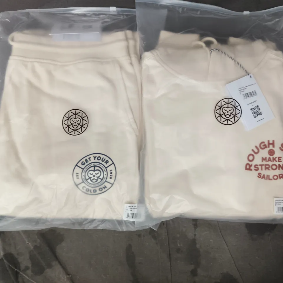 BOX OF APPROXIMATELY 12 ASSORTED BRASS MONKEY CLOTHING ITEMS TO INCLUDE HOODIES AND JOGGERS IN OFF WHITE - SIZES VARY