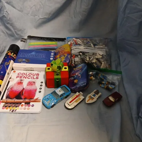 LARGE QUANTITY OF ASSORTED TOYS AND ACCESSORIES TO INCLUDE; LEGO, POKEMON CARD TINS, TEXET PENCIL CASE, PROFESSIONAL COLOUR PENCILS, UNICORN AND FAIRY BATH BEANS AND PLAYING CARDS