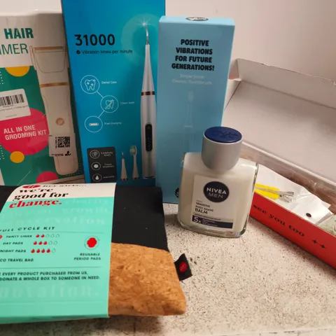 APPROX 12 ASSORTED BEAUTY PRODUCTS TO INCLUDE BODY HAIR TRIMMER, ELECTRIC TOOTHBRUSH, NIVEA POST SHAVE BALM, ETC