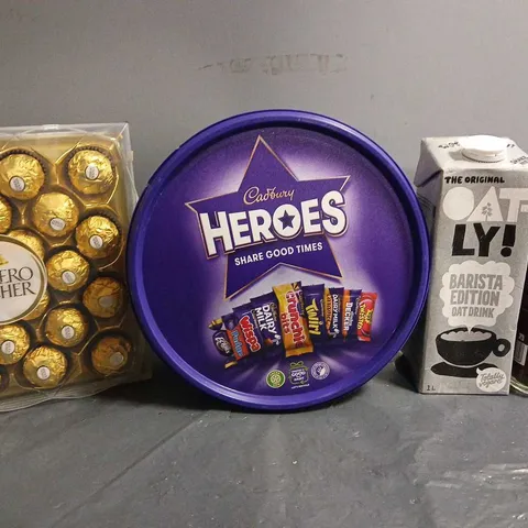 TOTE OF APPROX 7 ASSORTED FOOD ITEMS TO INCLUDE - CADBURYS HEROS , FERRERO ROCHER , OAT-LY ETC