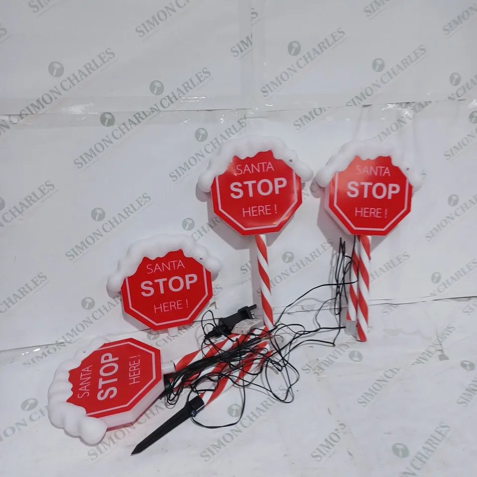FESTIVE SET OF 4 PRE-LIT SANTA STOP HERE 58CM STAKES