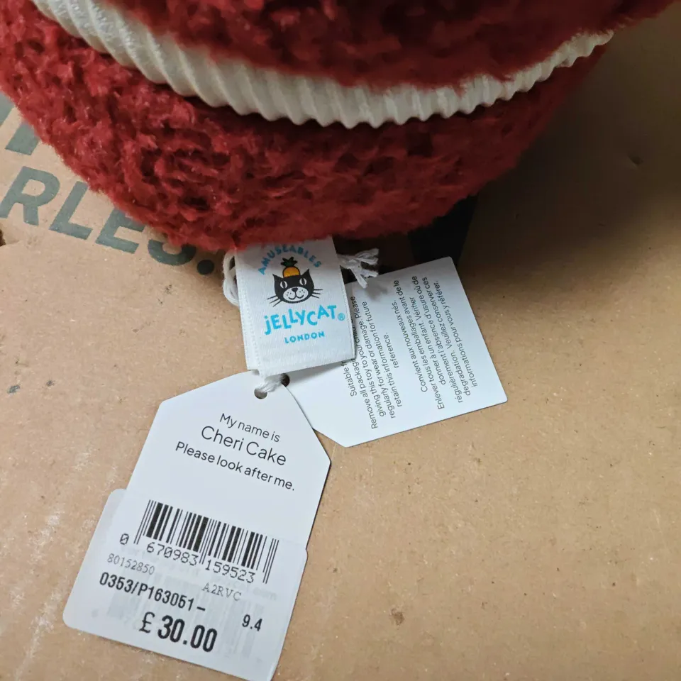 JELLYCAT LONDON CHERI CAKE PLUSH TOY – RED CAKE WITH CANDLE