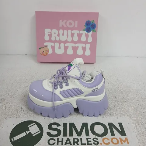 BOXED PAIR OF KOI FRUITTI TUTTI GRAPE JELLY TRAINERS IN PURPLE/WHITE SIZE UK 5