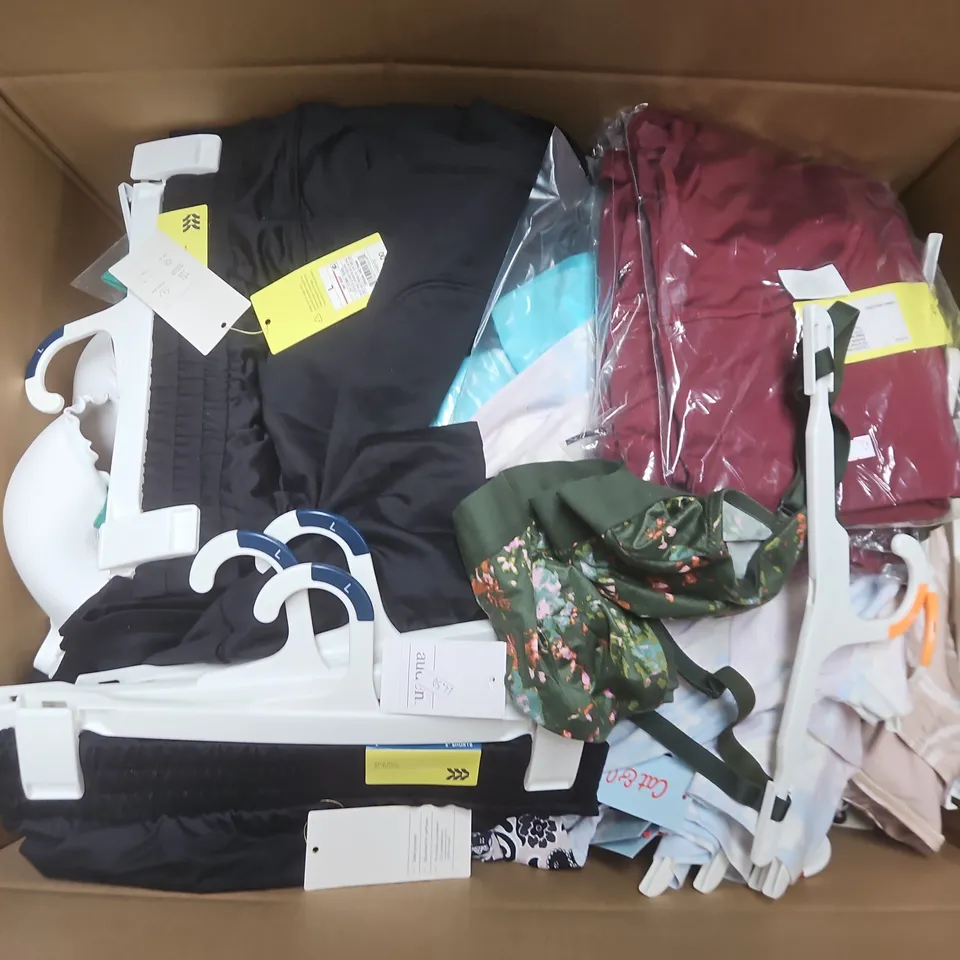 APPROXIMATELY 35 ASSORTED CLOTHING ITEMS IN VARIOUS SIZES, STYLES & COLOURS TO INCLUDE ITEMS SUCHS AS AUDEN BRALETTE, ALL IN MOTION MID-RISE SHORTS, CAT & JACK CHILDRENS DRESS, ETC - COLLECTION ONLY