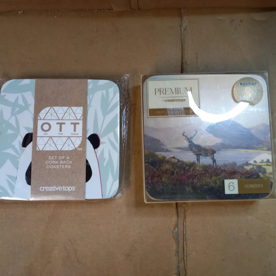 BOX OF APPROXIMATELY 80 PACKETS OF CREATIVE TOPS CORK BACKED COASTERS IN A STAG & PANDA DESIGN 