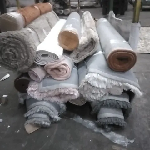 STILLAGE OF APPROXIMATELY 12 DESIGNER RUGS