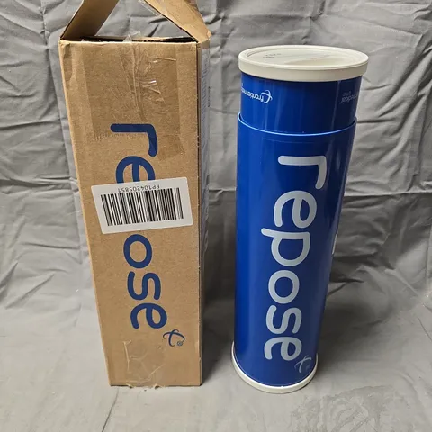 REPOSE CUSHION – BLUE CYLINDER PACKAGING