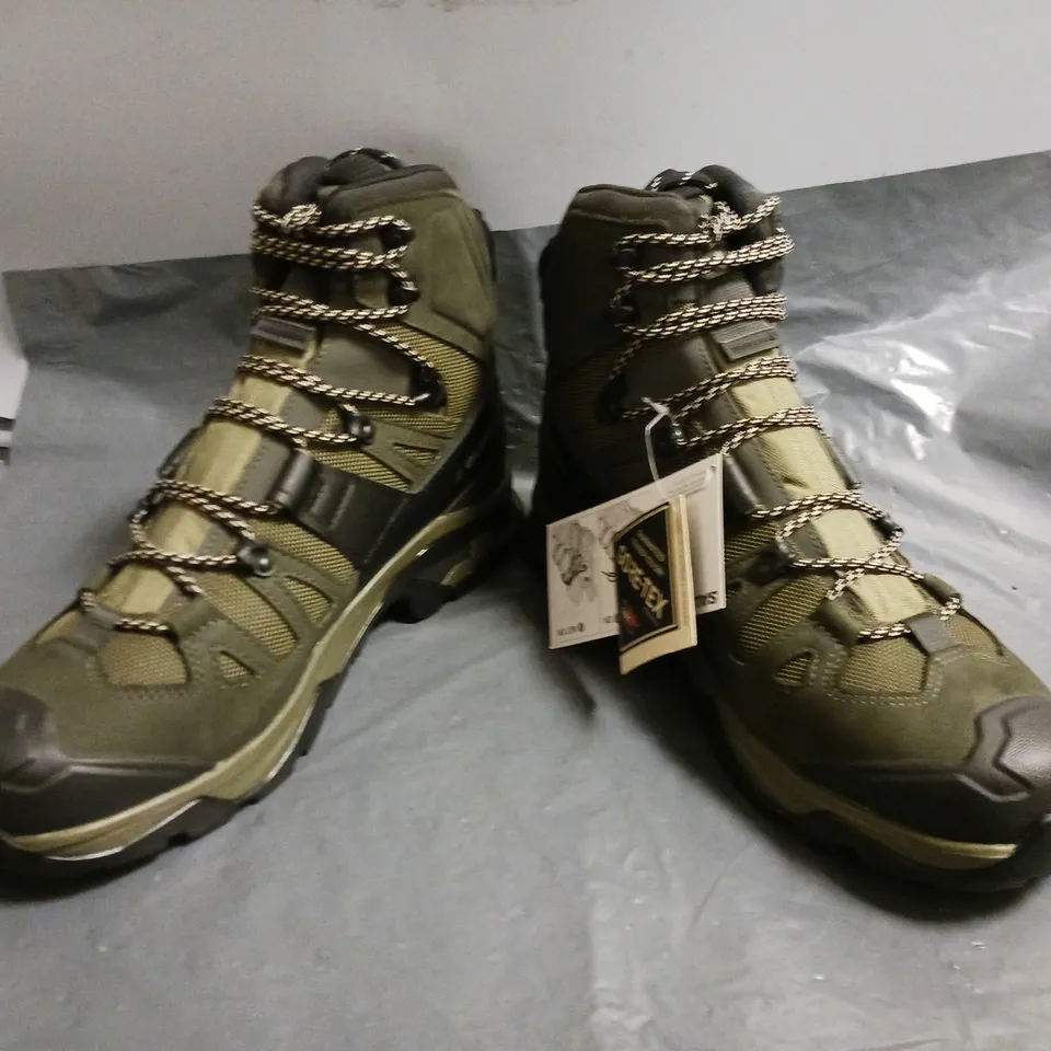 BOXED PAIR OF SALOMON ANKLE BOOTS IN GREEN SIZE UK 10.5