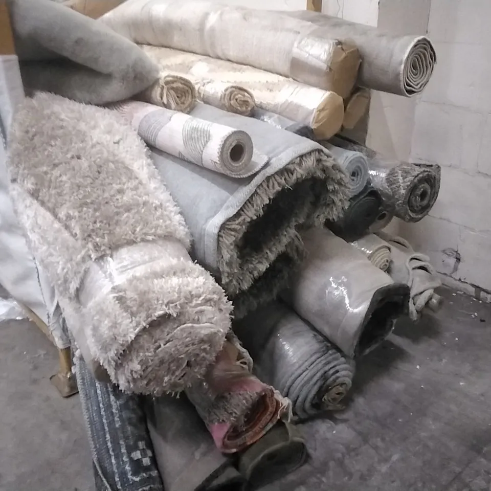 STILLAGE OF APPROXIMATELY 25 DESIGNER RUGS