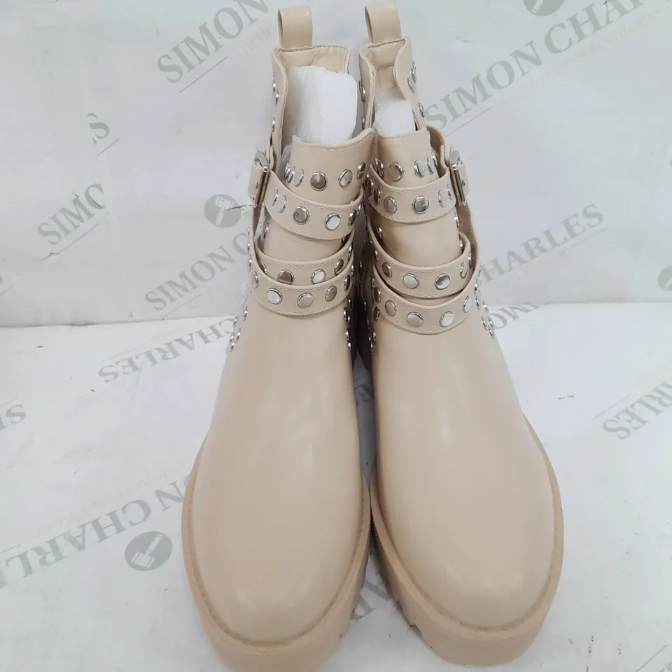 PAIR OF GIRLHOOD BUCKLE EMBELISHED BOOTS IN CREAM - SIZE 40