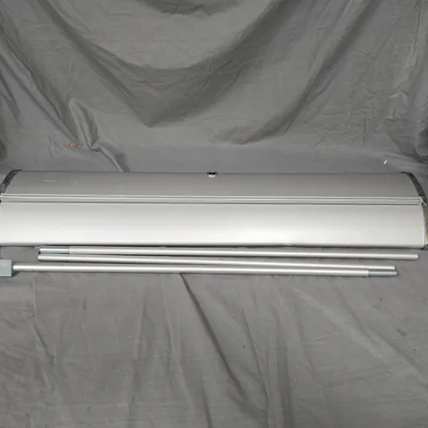 RETRACTABLE VINYL SIGN READING "RIDGE PHARMA" IN METAL CASE WITH LEGS. IN BLACK CARRY CASE